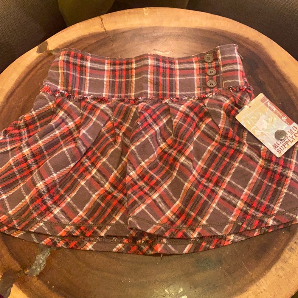 Orange/ brown plaid skirt. Size M 7/8